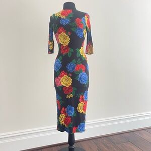 Alice and Olivia size 2 Black background mid length dress